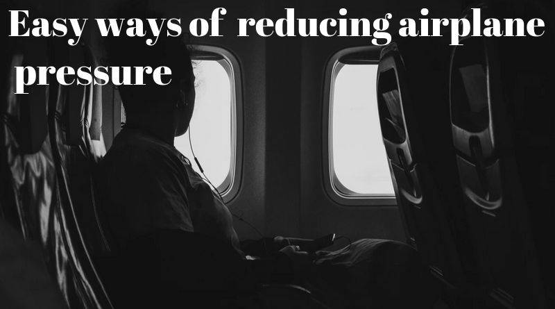 using earplugs or headphones to reduce the airplane pressure