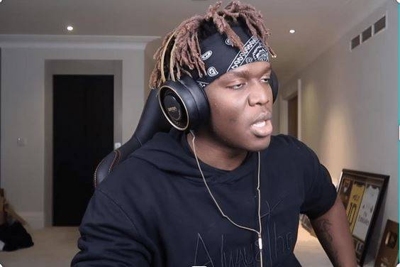 KSI here is wearing the Betron Retro Headphones in his studio